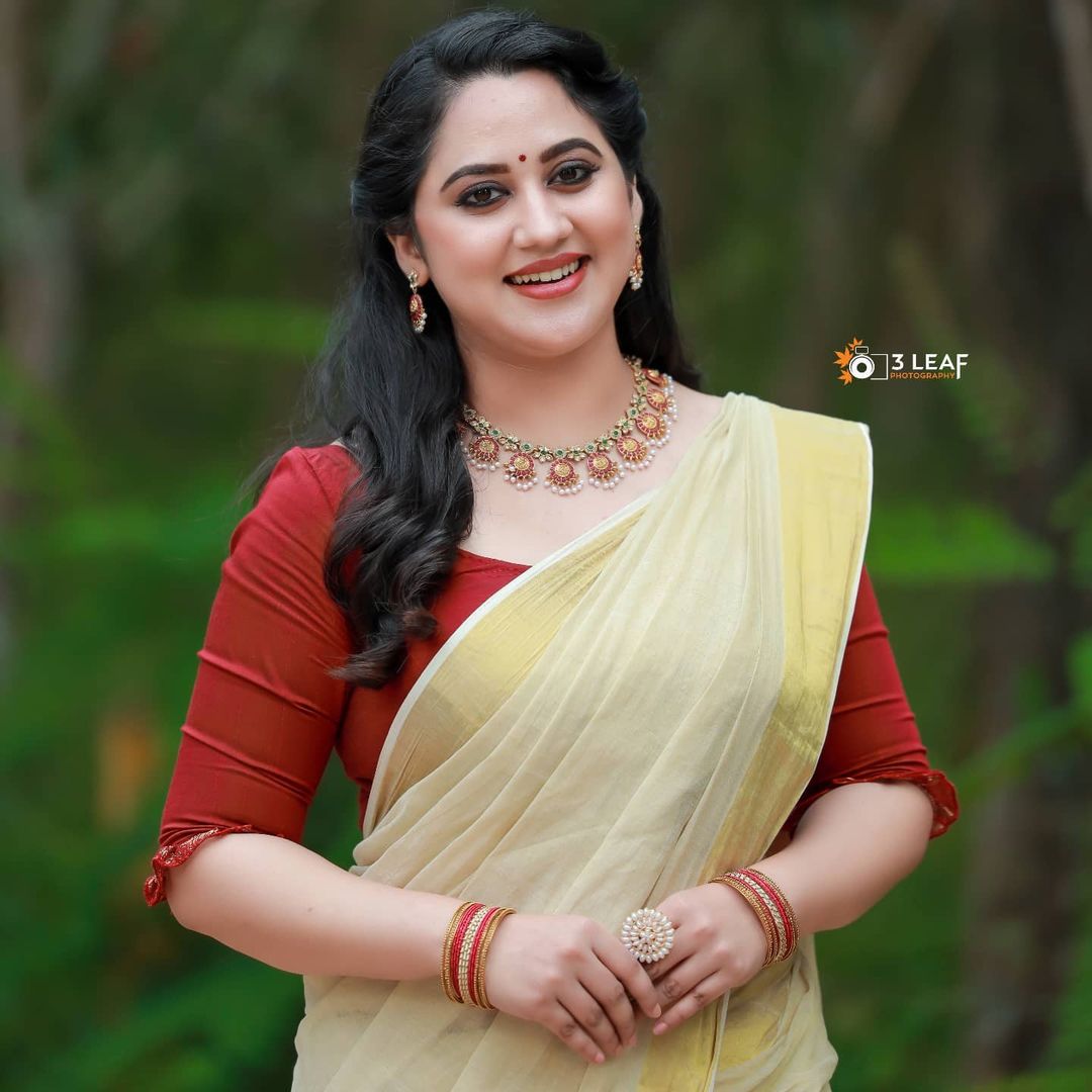 Malayalam Actress Miya George Stills in Yellow Saree Red Blouse